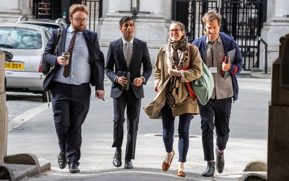Rishi Sunak arrives at Downing Street with members of his team in May - Heathcliff O'Malley 