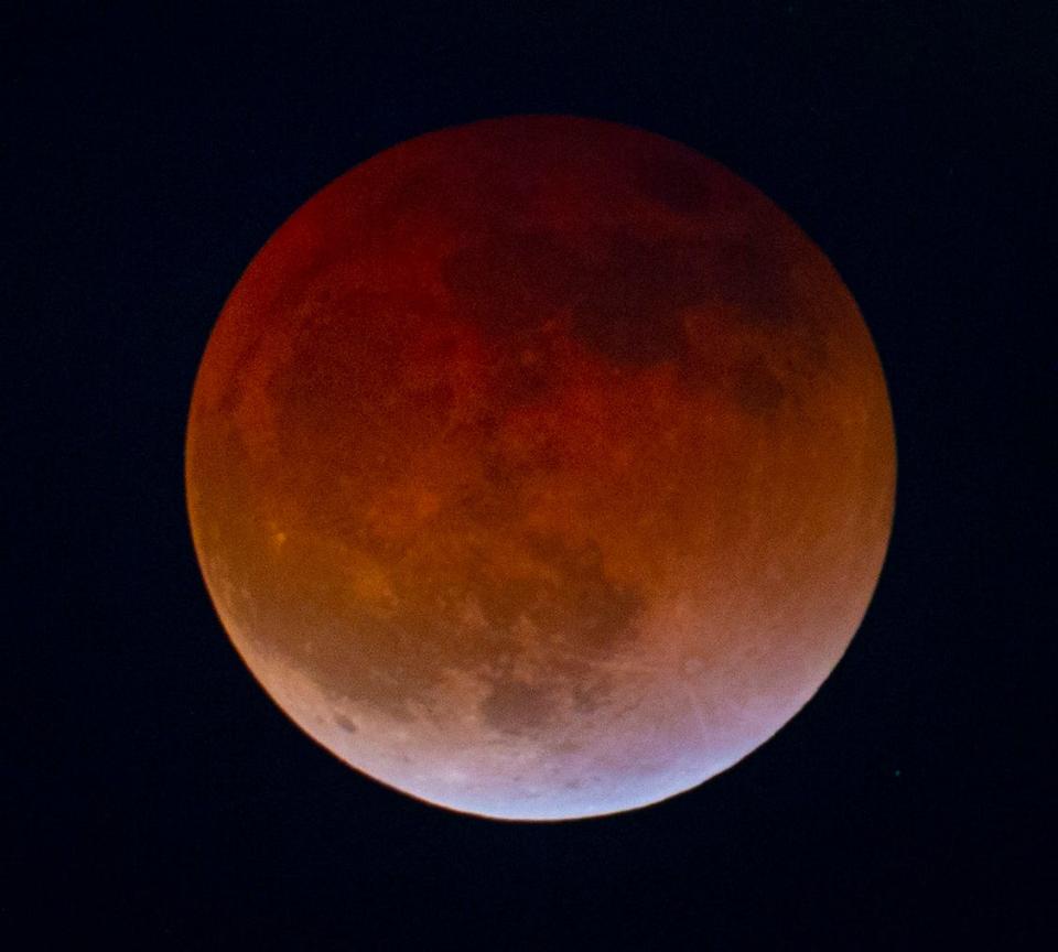 The total lunar eclipse and blood moon seen from the top of Skinner Butte in Eugene, Ore., Sunday night, May 15, 2022.
A lunar eclipse occurs when the sun, Earth, and moon align so that the moon passes into Earth's shadow. In a total lunar eclipse, the entire moon falls within the darkest part of Earth's shadow, called the umbra.