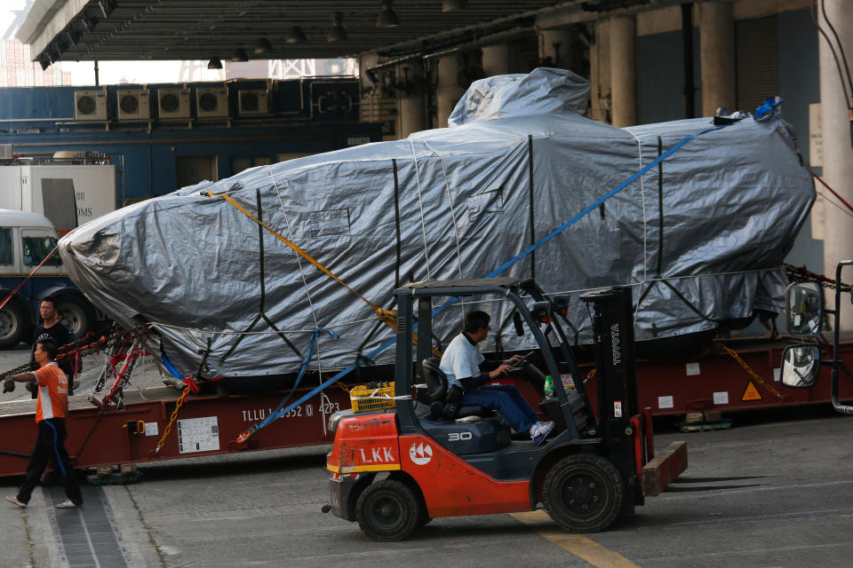 One of nine Terrex armoured vehicles, which belong to Singapore, waits to be loaded onto a truck at a cargo terminal in Hong Kong on 26 January 2017.