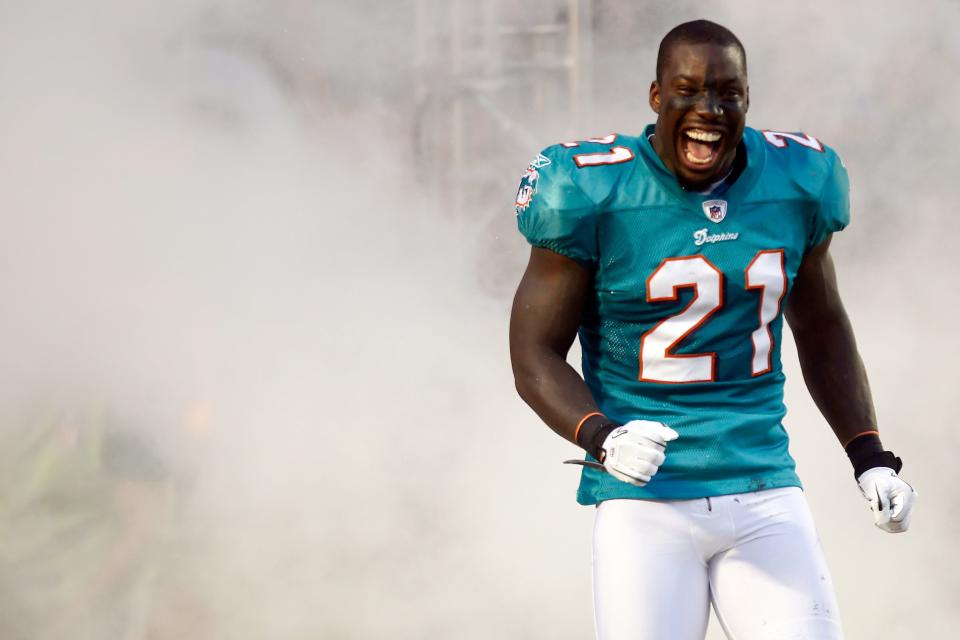 Vontae Davis #21 of the Miami Dolphins runs out to the field during introductions before taking on the New England Patriots at Sun Life Stadium on September 12, 2011 in Miami Gardens, Florida.