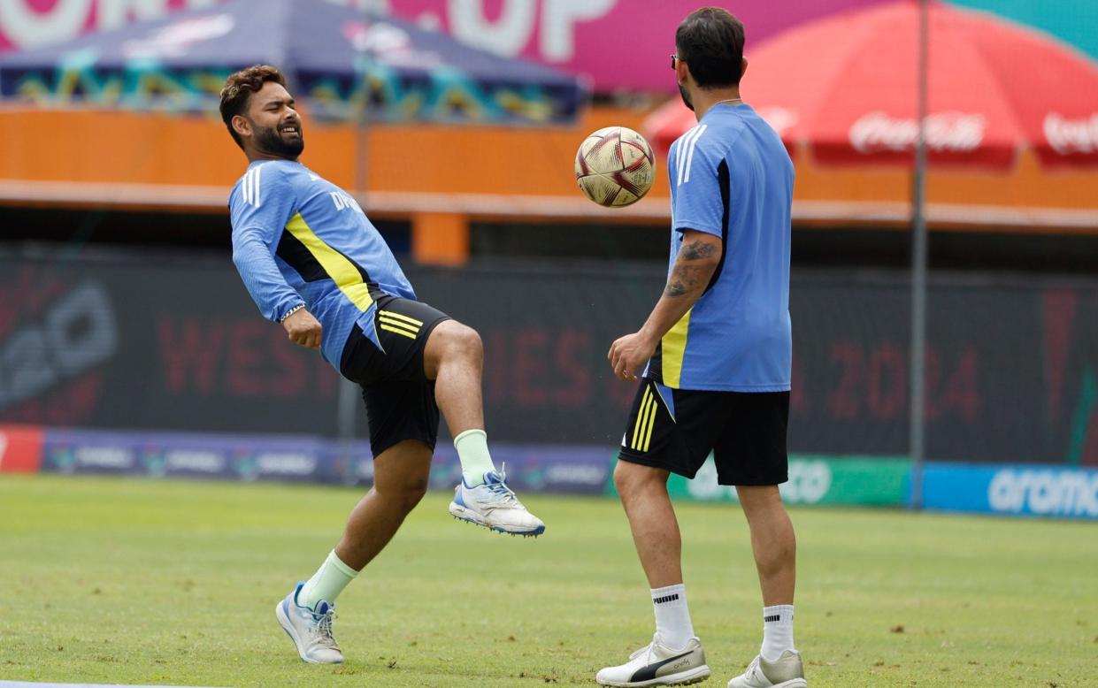 Rishabh Pant and Virat Kohli warming up playing football