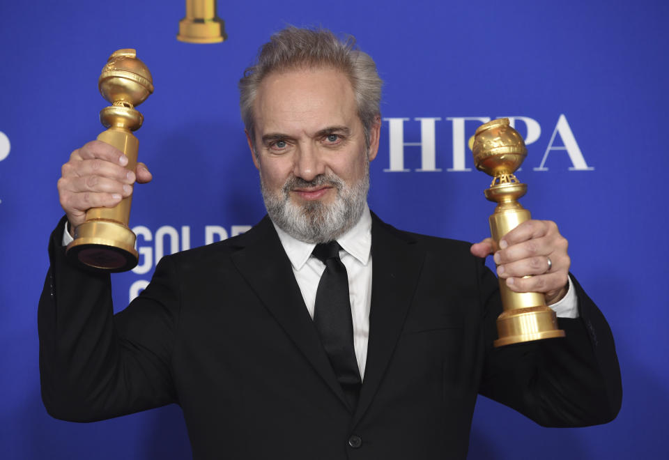 Sam Mendes poses in the press room with the awards for best director, motion picture and best motion picture drama for "1917" at the 77th annual Golden Globe Awards at the Beverly Hilton Hotel on Sunday, Jan. 5, 2020, in Beverly Hills, Calif. (AP Photo/Chris Pizzello)