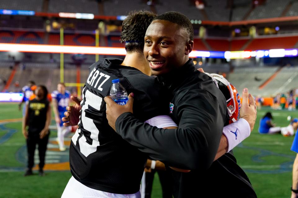 Florida Gators quarterback Graham Mertz (15) and recruit DJ Lagway hug after the game at Steve Spurrier Field at Ben Hill Griffin Stadium in Gainesville, FL on Thursday, April 13, 2023. [Jesse Gann/Gainesville Sun]