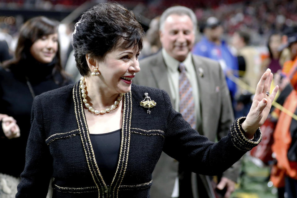 FILE - In this Thursday, Nov. 28, 2019 file photo, New Orleans Saints owner Gayle Benson waves to the crowd before the first half of an NFL football game between the Atlanta Falcons and the New Orleans Saints in Atlanta. Benson, who inherited the team following her husband Tom Benson's 2018 death, said the team's senior vice president of communications advised Archbishop Gregory Aymond to be “honest, complete and transparent” about clergy abuse. (AP Photo/John Bazemore)