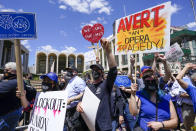 Union member demonstrators rally outside the Metropolitan Opera house during a "We Are the Met Rally," Thursday, May 13, 2021, in New York. Locked out stagehands and unions with contracts expiring this summer demonstrated outside the Met to protest the Opera's unfair treatment of workers, lockout of stagehands and the outsourcing of work. (AP Photo/Mary Altaffer)