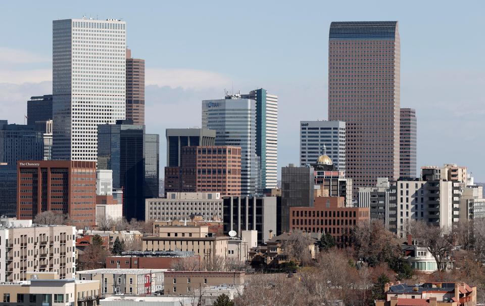 Downtown Denver skyline is shown Wednesday, April 15, 2020, in Denver.