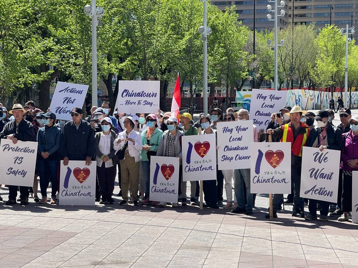 People demonstrated outside Edmonton city hall Saturday for, what organizers called, the Rally for Safety in Chinatown. The rally comes after two men were recently killed in the area. (Emily Fitzpatrick/CBC - image credit)