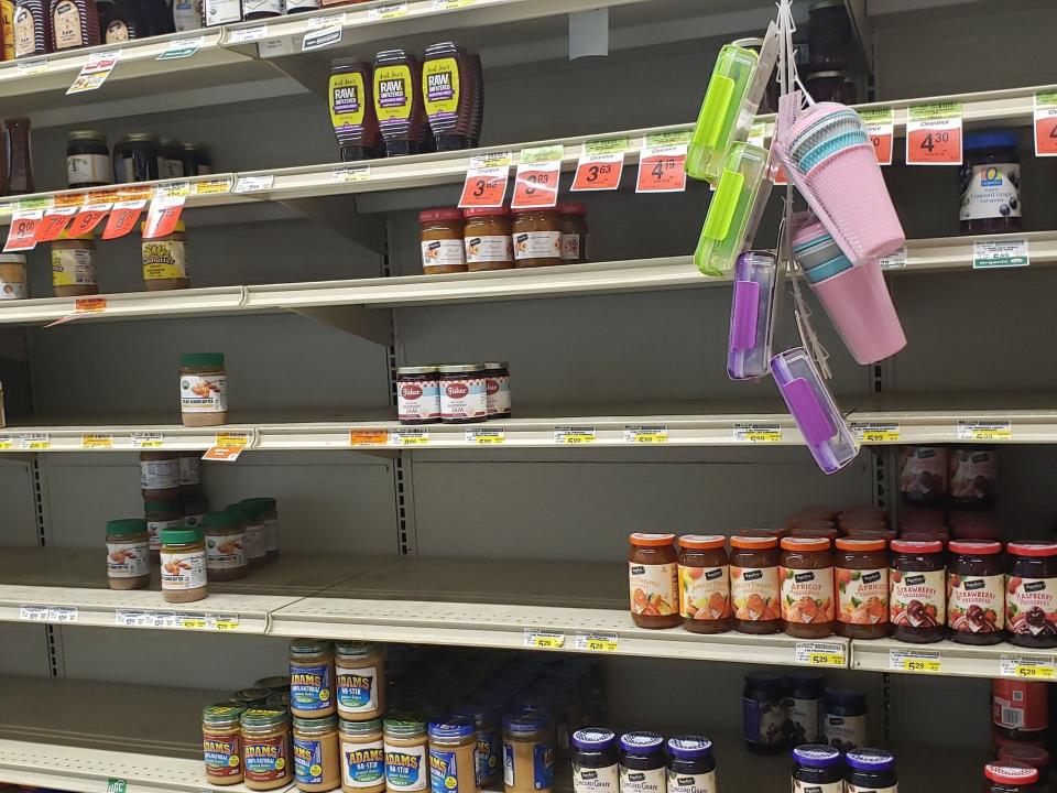 nearly empty shelves at Alaskan grocery store
