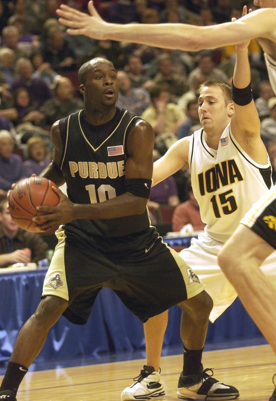 Purdue guard Brandon McKnight (10) attempts to find a player to pass to as Iowa guard Jack Brownlee (15) defends during first half action in the first round of the Big Ten Tournament Thursday March 10, 2005 in Chicago, Ill. Photo by Joe Raymond Sports Folder