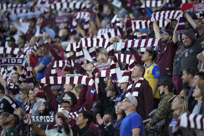 Fans welcome the Colorado Rapids to the pitch to face Los Angeles FC in an MLS soccer match Sunday, Nov. 7, 2021, in Commerce City, Colo. (AP Photo/David Zalubowski)