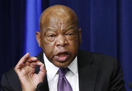 U.S. Representative John Lewis speaks before he helps unveiling the Harvey Milk Forever Stamp at its dedication ceremony at the White House in Washington May 22, 2014. The ceremony marks the first day of issue for the stamp honoring Milk. REUTERS/Larry Downing