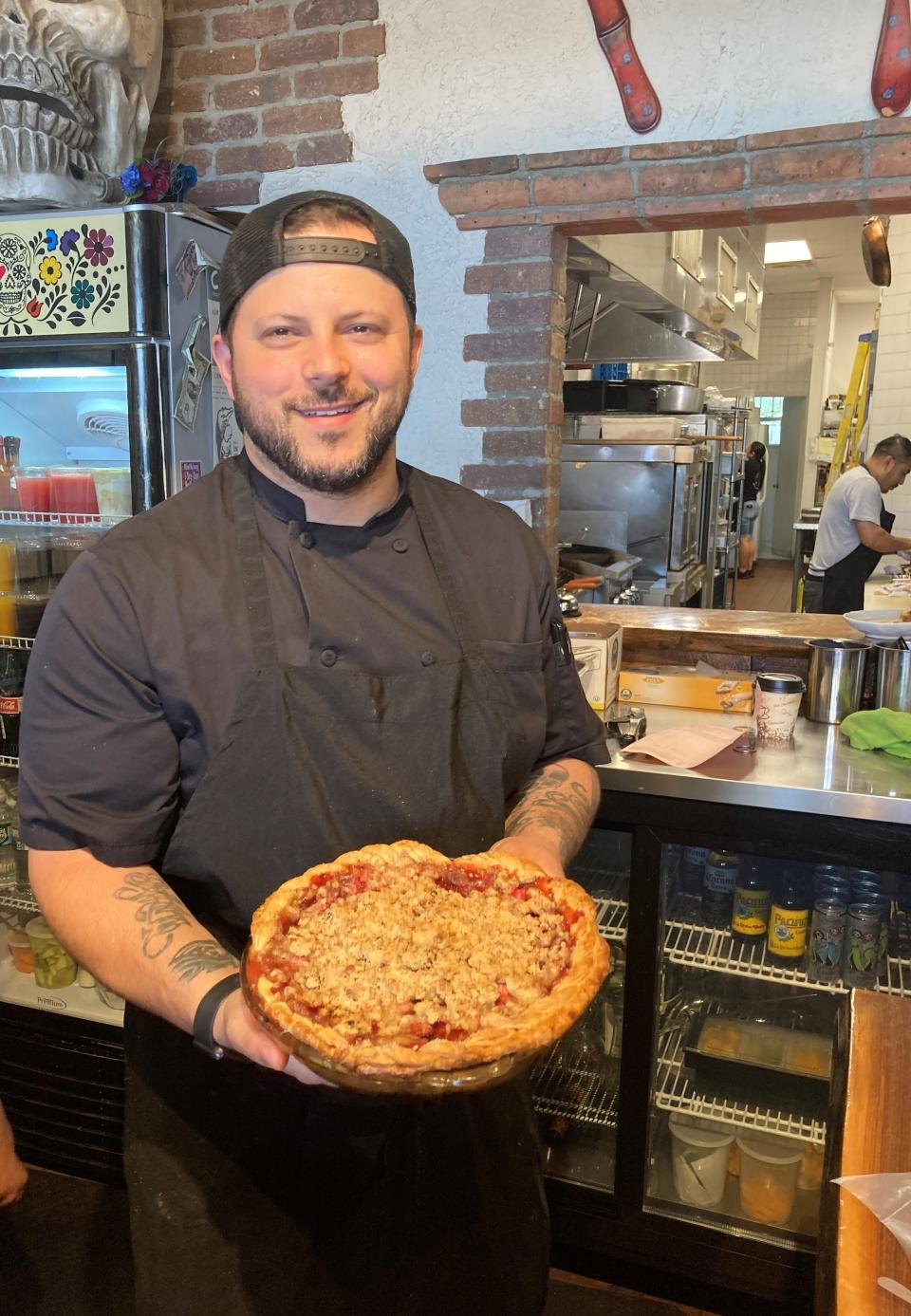 Craft Taqueria Chef/Owner Jeff Kreisel, with his fresh-from-the-oven strawberry rhubarb pie. Though tacos are his focus, he also offers a lot more including housemade Oreos and granola. Photographed June 8, 2022.