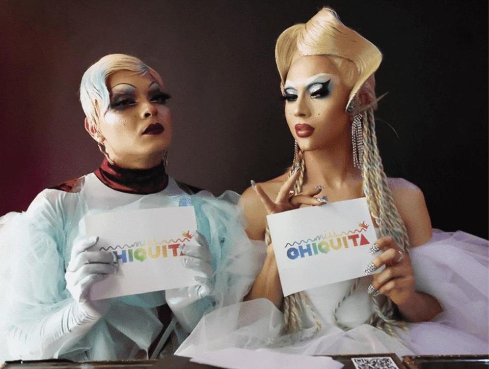 Two drag queens holding cards that say Chiquita