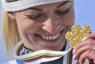 Switzerland's Lara Gut-Behrami eyes her gold medal after a women's giant slalom, at the alpine ski World Championships, in Cortina d'Ampezzo, Italy, Thursday, Feb. 18, 2021. (AP Photo/Marco Tacca)