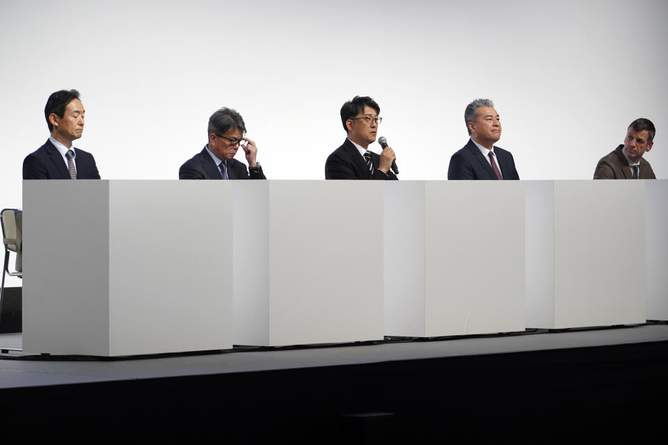 Koji Sato, center, Toyota Motor Corp.'s chief branding officer and CEO-designate speaks during a press conference Monday, Feb. 13, 2023, in Tokyo. (AP Photo/Eugene Hoshiko)