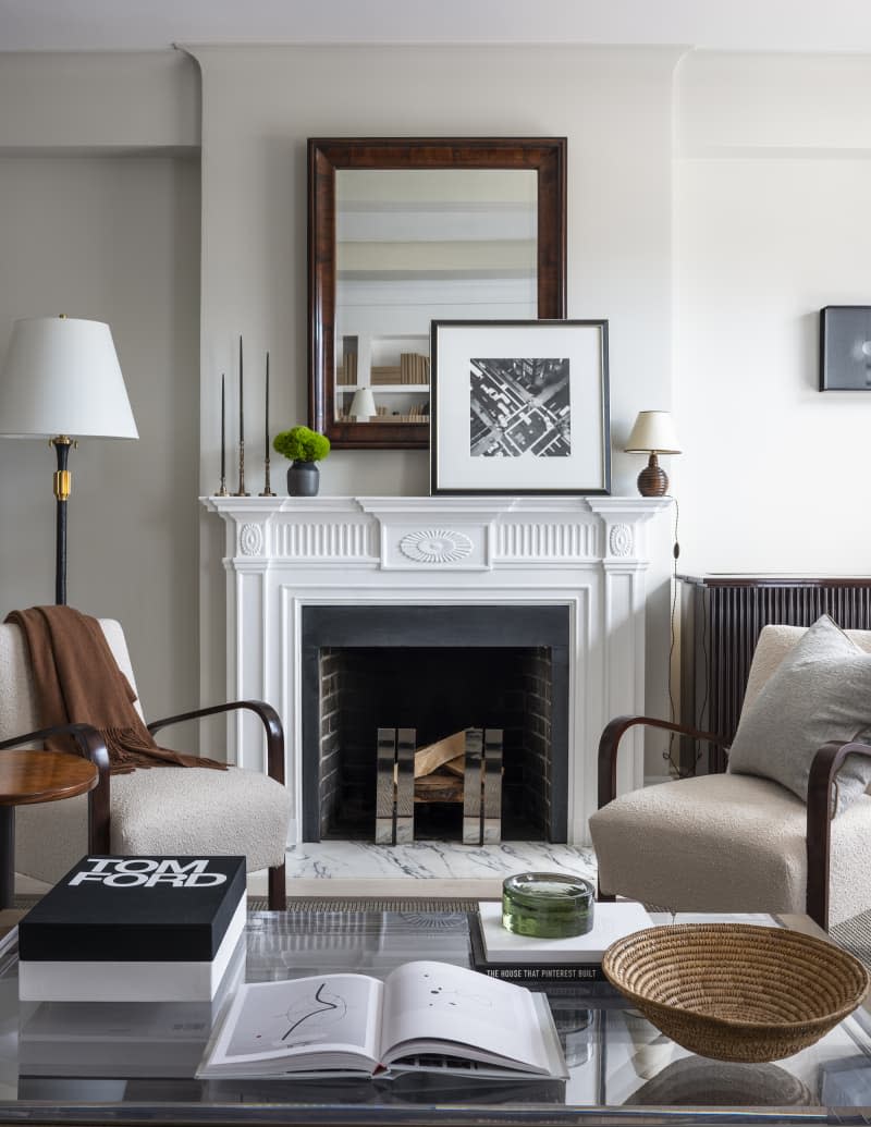 white living room with gray and neutral toned furniture with fireplace