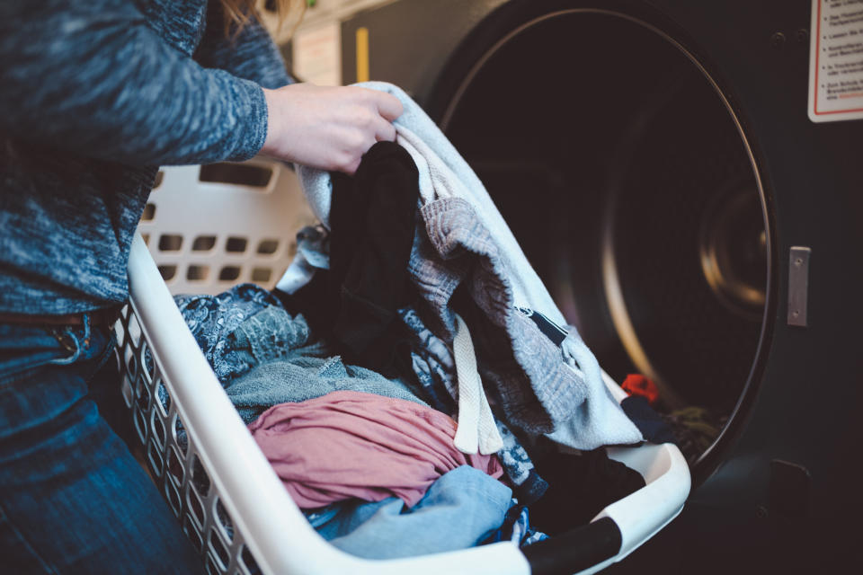 Woman washing her PJs and other clothes. (Getty Images)