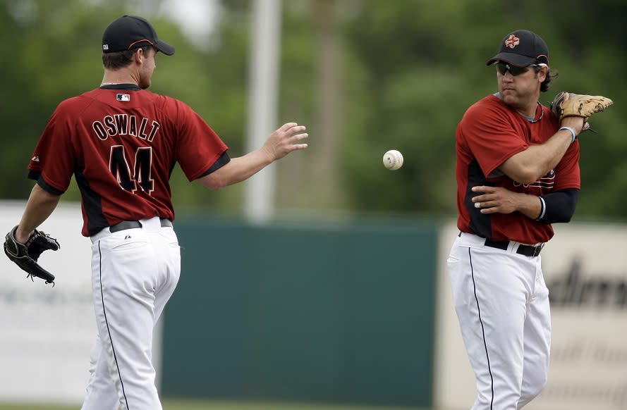 Longtime Astros teammates Roy Oswalt (left) and Lance Berkman are looking at a short stay on the Hall of Fame ballot. (AP)