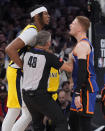referee Scott Foster (48) gets in between Indiana Pacers' Myles Turner, left, and New York Knicks' Donte DiVincenzo during the second half of Game 5 in an NBA basketball second-round playoff series, Tuesday, May 14, 2024, in New York. The Knicks won 121-91. (AP Photo/Frank Franklin II)