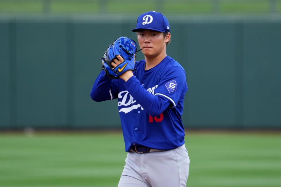 Yoshinobu Yamamoto pitches during the third inning against the Rangers.