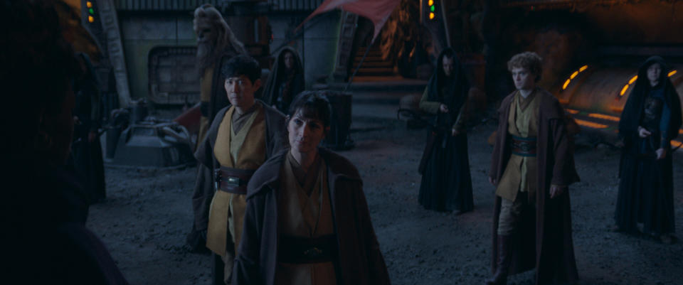 (Clockwise from center): Jedi Master Indara (Carrie-Anne Moss), Master Sol (Lee Jung-jae), Jedi Master Kelnacca (Joonas Suotamo) and (second from right) Master Torbin (Dean Charles Chapman) in Lucasfilm's THE ACOLYTE, exclusively on Disney+. ©2024 Lucasfilm Ltd. & TM. All Rights Reserved.