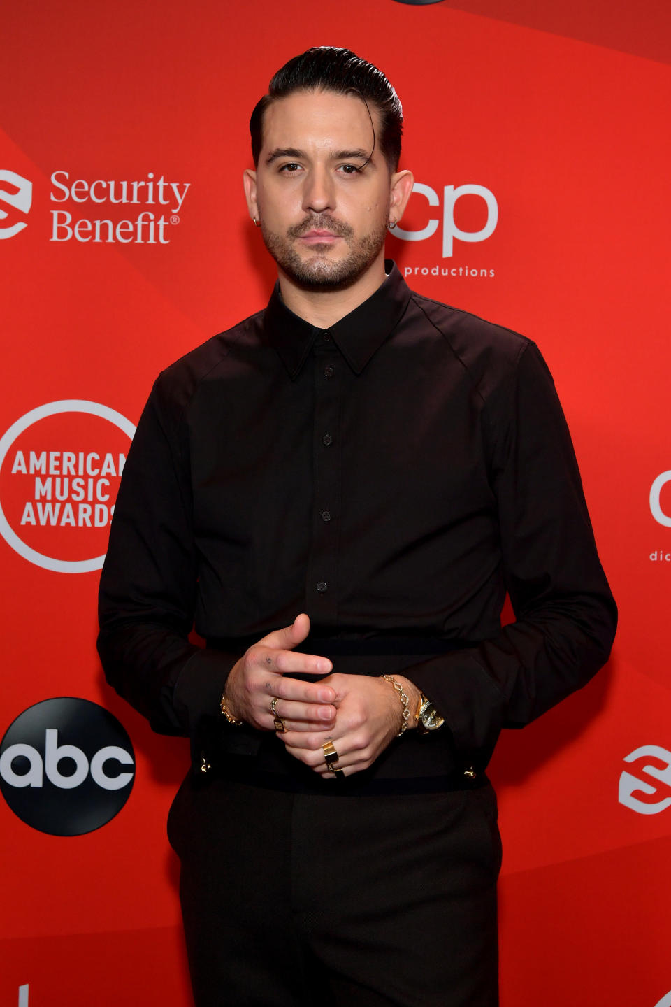 G-Eazy poses for a photo at an event