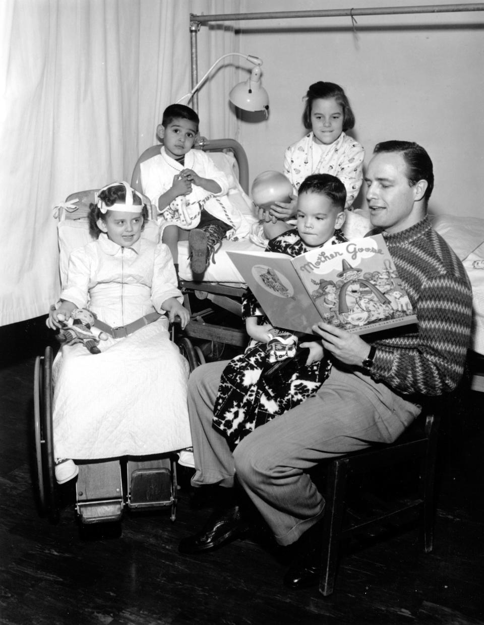 Marlon Brando reading to children with polio.