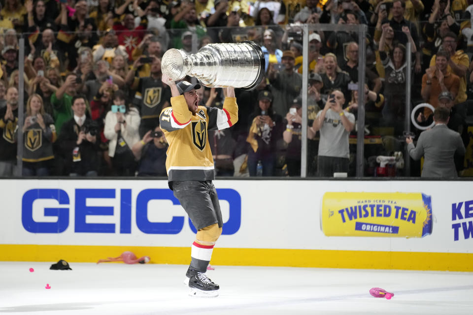 Vegas Golden Knights right wing Reilly Smith skates with the Stanley Cup after the Knights defeated the Florida Panthers 9-3 in Game 5 of the NHL hockey Stanley Cup Finals Tuesday, June 13, 2023, in Las Vegas. The Knights won the series 4-1. (AP Photo/John Locher)