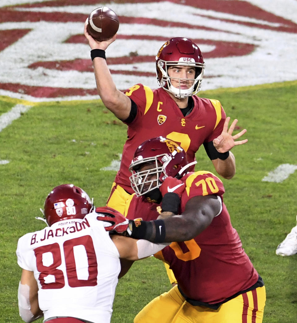 Southern California quarterback Kedon Slovis (9) passes against Washington State in the first half of an NCAA college football game in Los Angeles, Sunday, Dec. 6, 2020. (Keith Birmingham/The Orange County Register via AP)