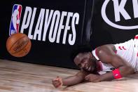 Toronto Raptors' OG Anunoby reacts after hitting the stanchion hard after being fouled by Boston Celtics' Daniel Theis on a breakaway shot during the second half of an NBA conference semifinal playoff basketball game Friday, Sept. 11, 2020, in Lake Buena Vista, Fla. (AP Photo/Mark J. Terrill)