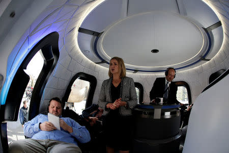 Ariane Cornell (C) gives tours to the media of Blue Origin's Crew Capsule mockup at the 33rd Space Symposium in Colorado Springs, Colorado, United States April 5, 2017. REUTERS/Isaiah J. Downing