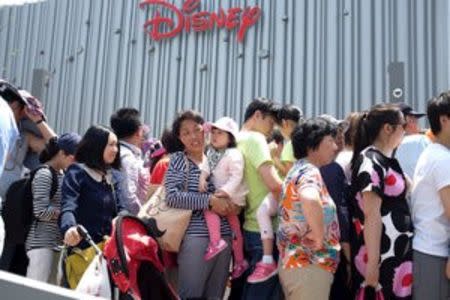 People queue to enter China's first Disney store at Pudong financial district in Shanghai May 20, 2015. REUTERS/Aly Song/File Photo
