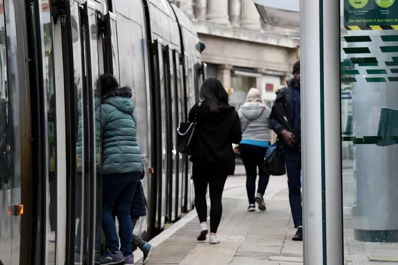 People boarding a tram in Nottingham -Credit:Nottingham Post/Marie Wilson