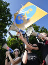 Protesters display posters in support of the independent broadcaster TVN during a demonstration in Warsaw, Poland, Tuesday, Aug. 10, 2021. Larger nationwide demonstrations are planned across Poland later on Tuesday against a bill widely viewed as a effort by the country's ruling nationalist party to silence an independent, U.S.-owned, television broadcaster critical of the government. TVN is owned by Discovery Inc. (AP Photo/Czarek Sokolowski)