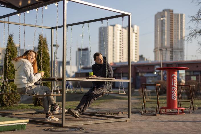 A couple enjoys a cup of tea in a Kyiv park on Friday (REUTERS)