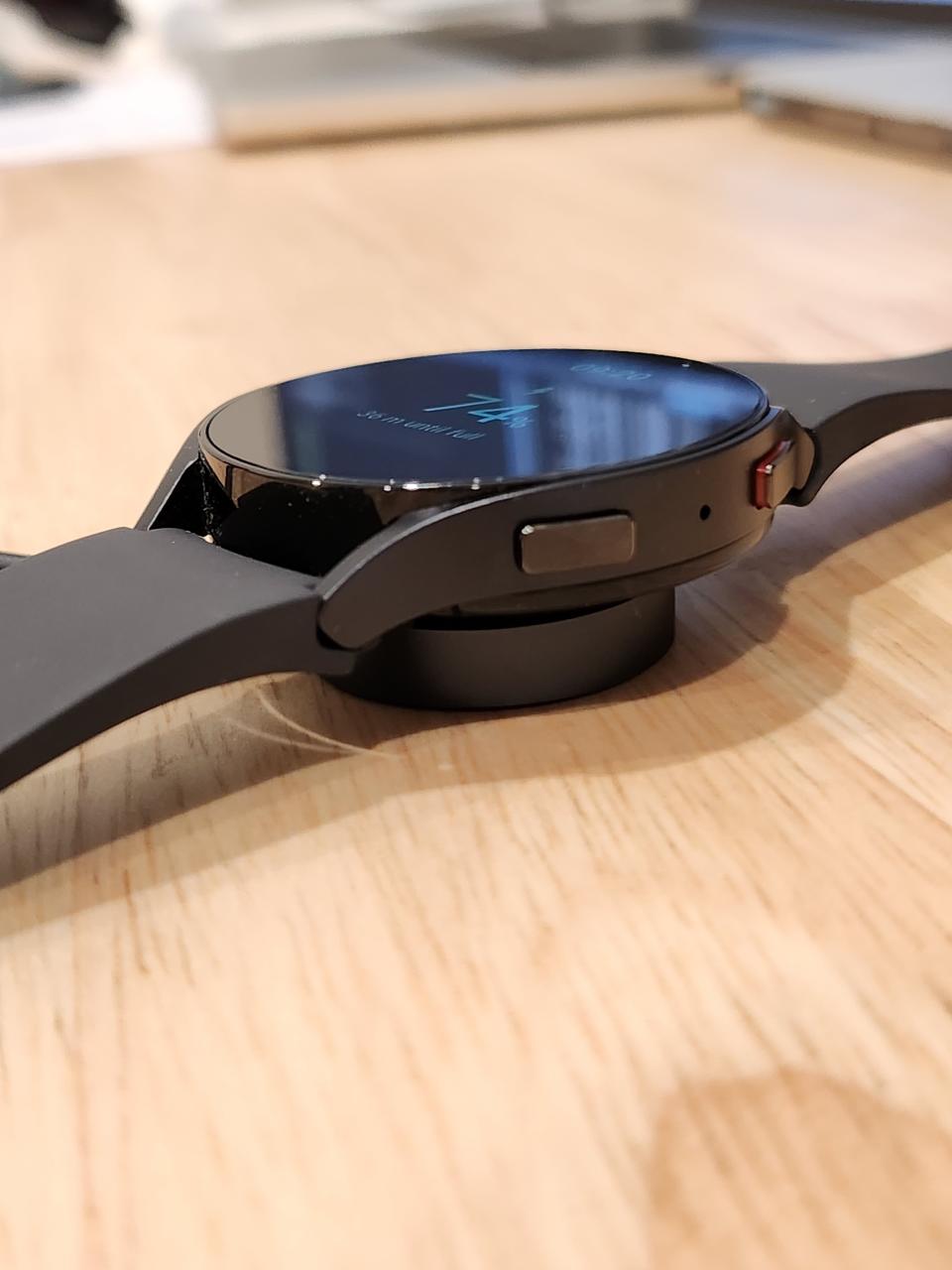 the Watch6 on its magnetic fast charger