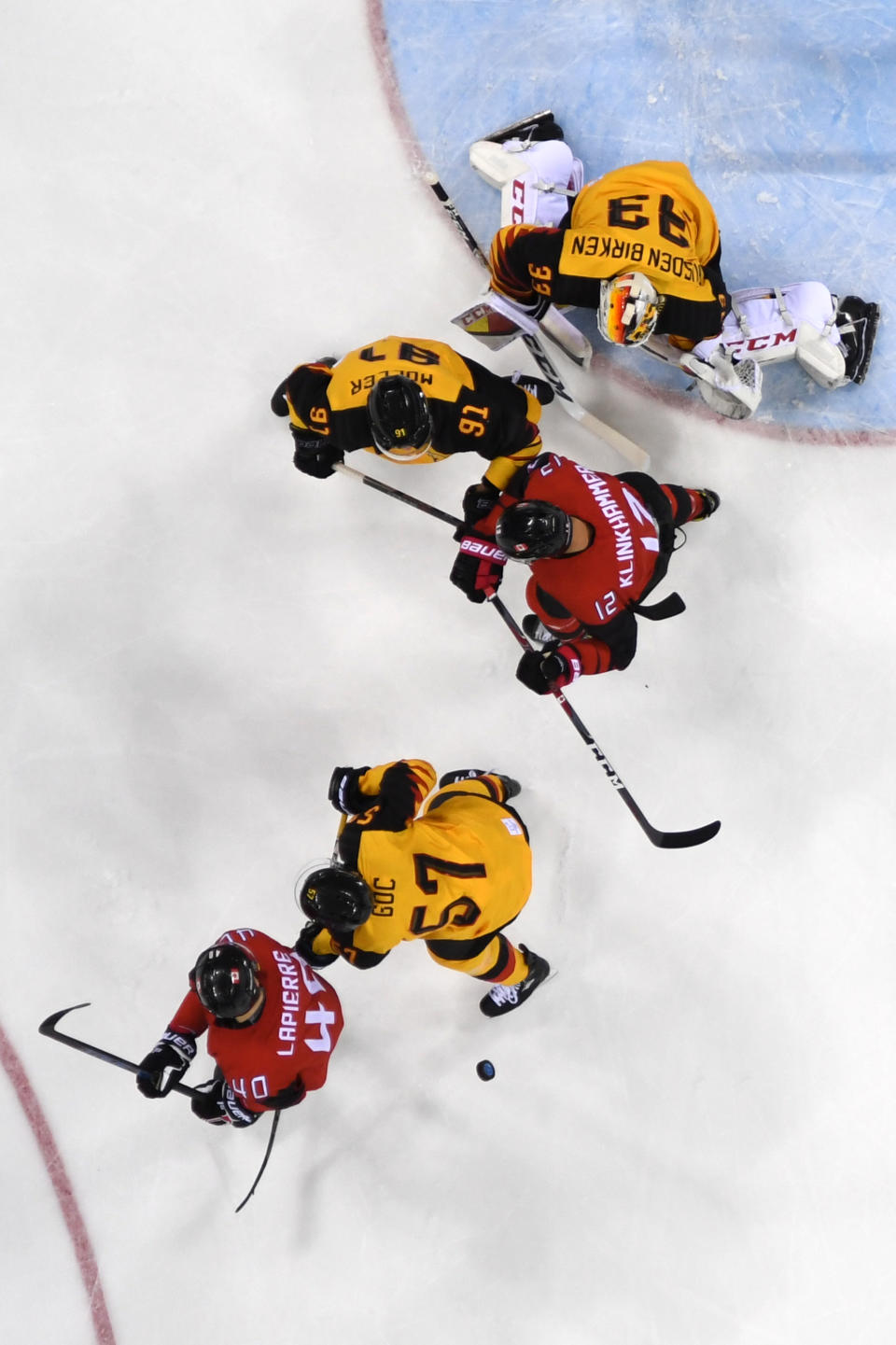 <p>Germany’s Danny aus den Birken (top) watches a play in the Men’s Ice Hockey semi-final’s match between Canada and Germany during the PyeongChang 2018 Winter Olympic Games at the Gangneung Hockey Centre on February 23, 2018.<br> (Photo by Kirill Kudryavtsev/AFP/Getty Images) </p>