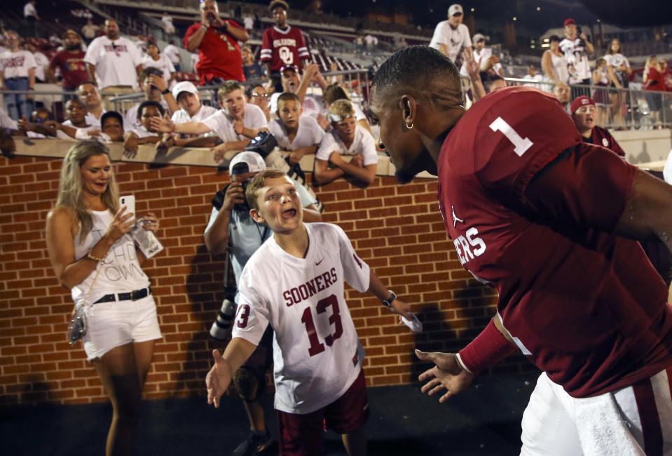 Sep 1, 2019; Norman, OK, USA; Oklahoma Sooners quarterback Jalen Hurts (1) high fives a fan after the game against the Houston Cougars at Gaylord Family - Oklahoma Memorial Stadium. Mandatory Credit: Kevin Jairaj-USA TODAY Sports