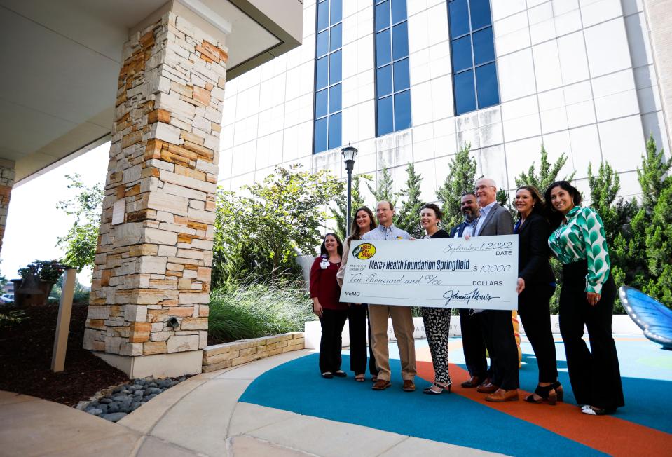 Bass Pro Shops Senior Director of Conservation Bob Ziehmer (third from left) and Bass Pro Senior Manager of Community Sarah Hough (second from left) present a check to the Mercy Health Foundation Springfield for $10,000 to help pay for a new 300-gallon aquarium at Mercy Kids ChildrenÕs Hospital on Thursday, Sept. 1, 2022.