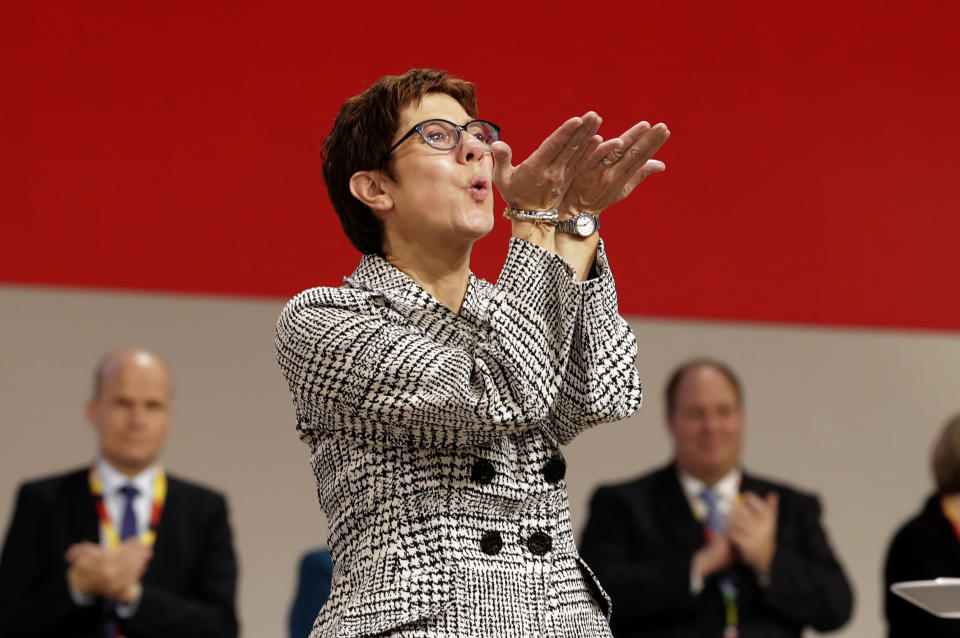 Newly elected CDU chairwoman Annegret Kramp-Karrenbauer blows a kiss at the party convention of the Christian Democratic Party CDU in Hamburg, Germany, Friday, Dec. 7, 2018, after German Chancellor Angela Merkel didn't run again for party chairmanship after more than 18 years at the helm of the party. (AP Photo/Michael Sohn)