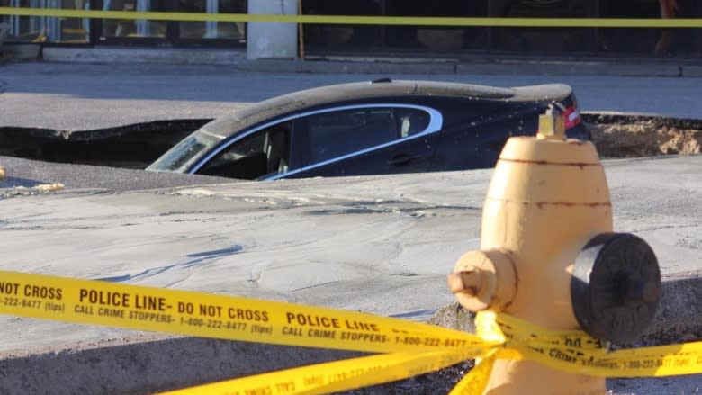 Toronto sinkhole swallows Jaguar