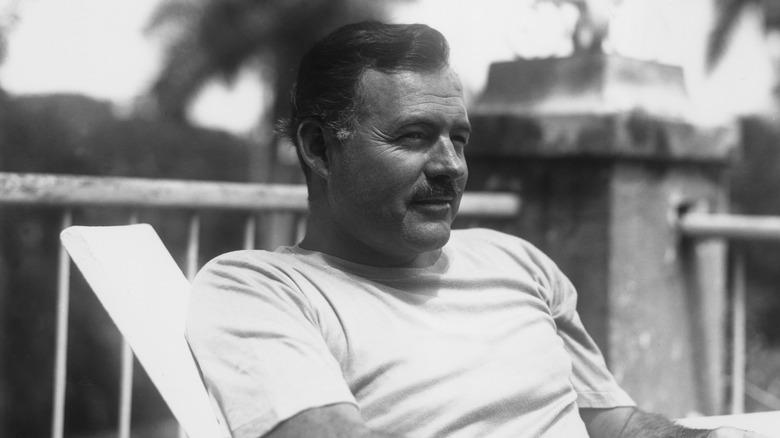 A black and white photo of Ernest Hemingway smiling in Cuba