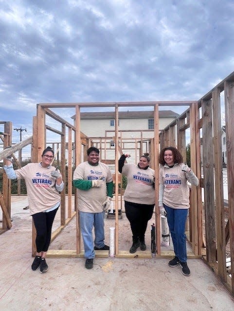Staff from the Perth Amboy Office of Economic & Community Development volunteering at the Inslee Street build of a Morris Habitat Home