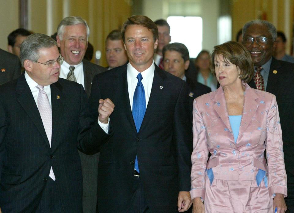 Then House Rep Menendez walks with vice presidential candidate and North Carolina Senator John Edwards and then-House Minority Leader Nancy Pelosi in July 2004 (Getty Images)