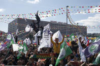 Thousands of supporters of pro-Kurdish Peoples' Democratic Party, or HDP, gather to celebrate the Kurdish New Year and to attend a campaign rally for local elections that will test the Turkish president's popularity, in Istanbul, Sunday, March 24, 2019. The HDP held the event amid the municipal office races that have become polarizing and a government crackdown on its members for alleged links to outlawed Kurdish militants. (AP Photo/Emrah Gurel)