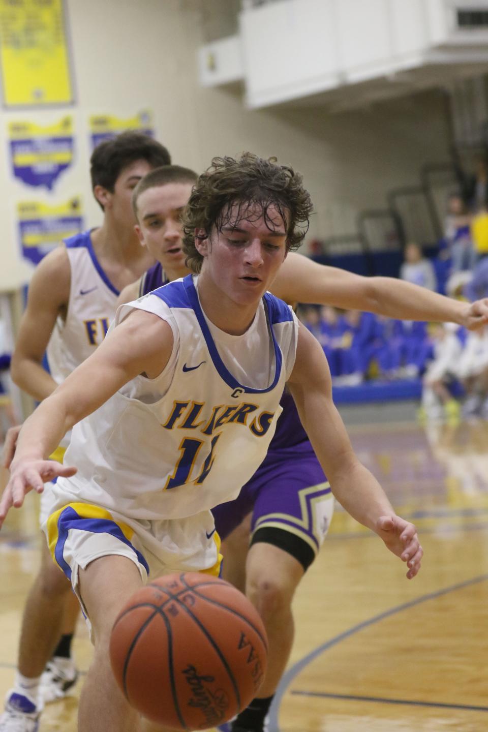 Clyde's Brennan Wilson goes after a loose ball.