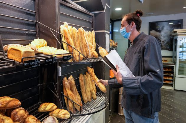 Baker Hugo Hardy prepares baguettes to be sold at Bigot bakery in Versailles, west of Paris, Tuesday, Oct. 26, 2021.  (Photo: via Associated Press)