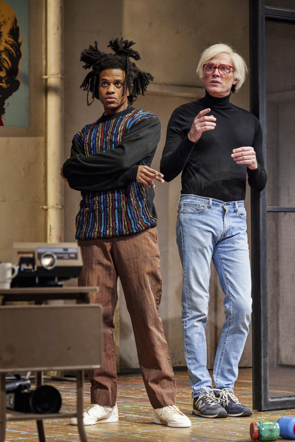 This image provided by Jeremy Daniel shows Jeremy Pope as Jean-Michel Basquiat, left, and Paul Bettany as Andy Warhol, in a scene from "The Collaboration," Anthony McCarten's fictional account about the real period in 1984 when Warhol was compelled to work with Basquiat, a new sensation and potential rival of the New York art world. (Jeremy Daniel via AP)