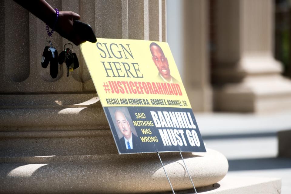 <div class="inline-image__caption"><p>A sign calling for justice for Ahmaud Arbery and the recall of DA George Barnhill Sr. sits outside the Glynn County Courthouse on July 17, 2020.</p></div> <div class="inline-image__credit">Sean Rayford/Getty Images</div>