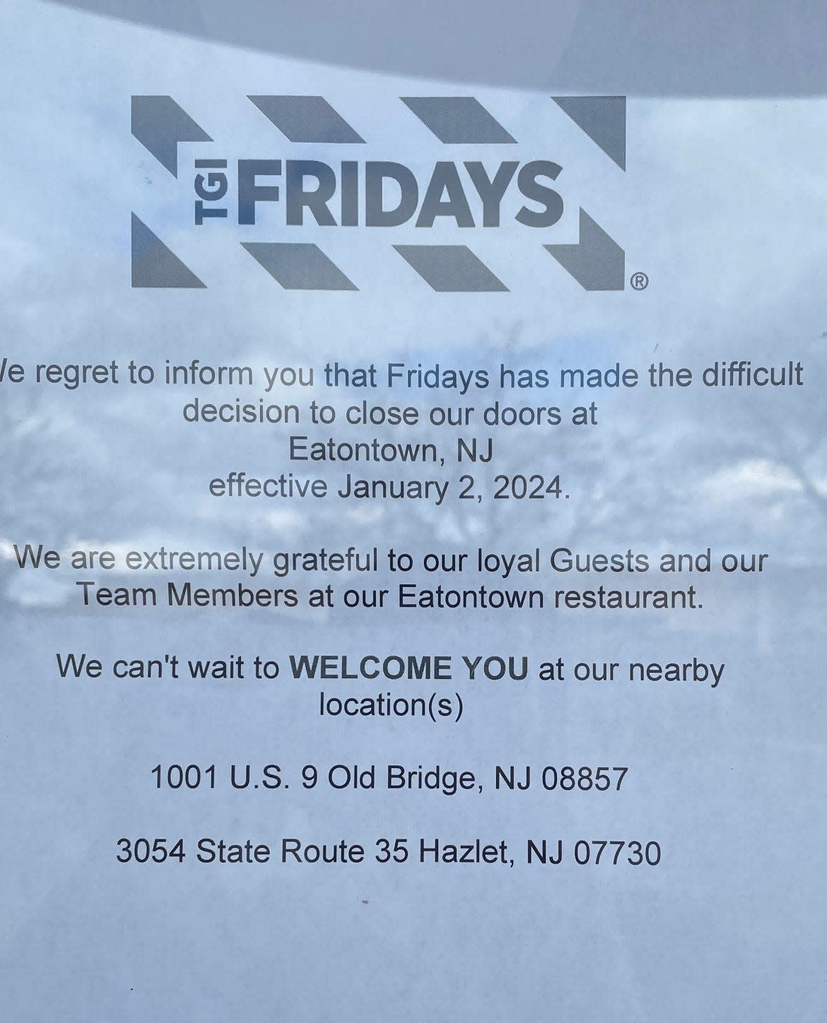 A sign on the entrance to TGI Fridays in Eatontown tells patrons the restaurant's location has been closed.